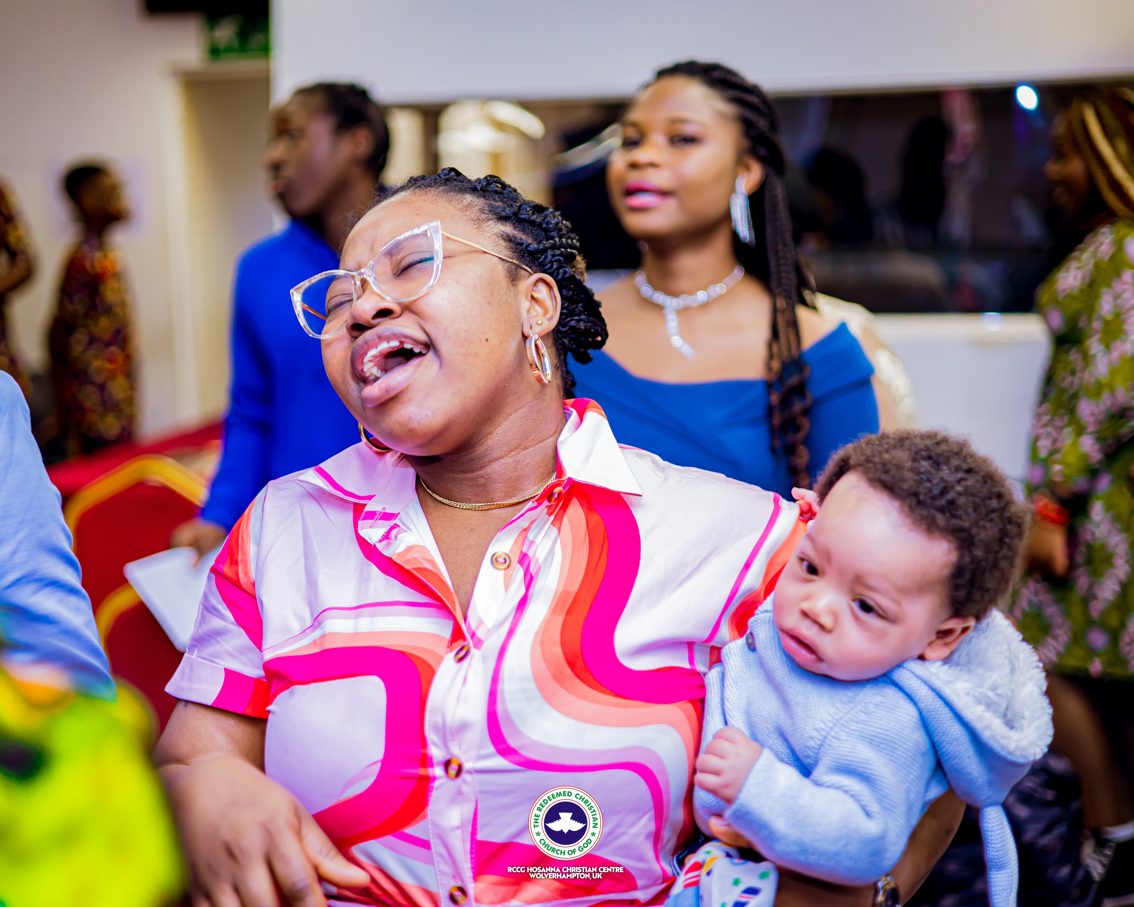 baby with happy mother during service